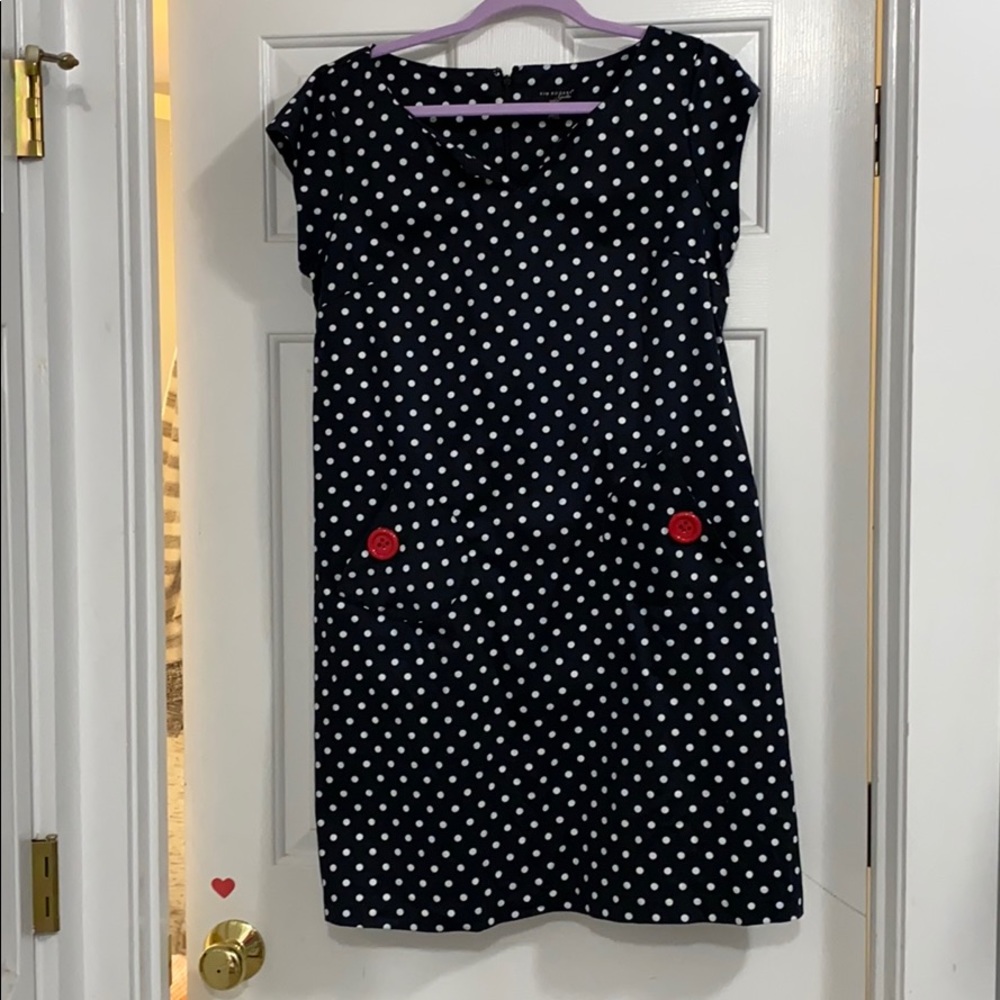 Dress with red button and pocket detailing